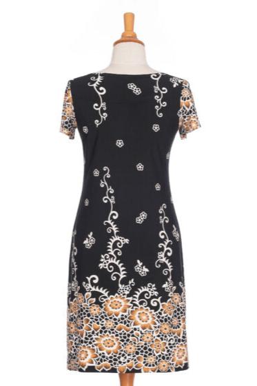 Back view of the Classic Dress by Rien ne se Perd in Black and Gold, a semi-fitted black  sheath dress with a gold floral pattern, short sleeves, and an above the knee length, is shown a mannequin in front of a white background. 