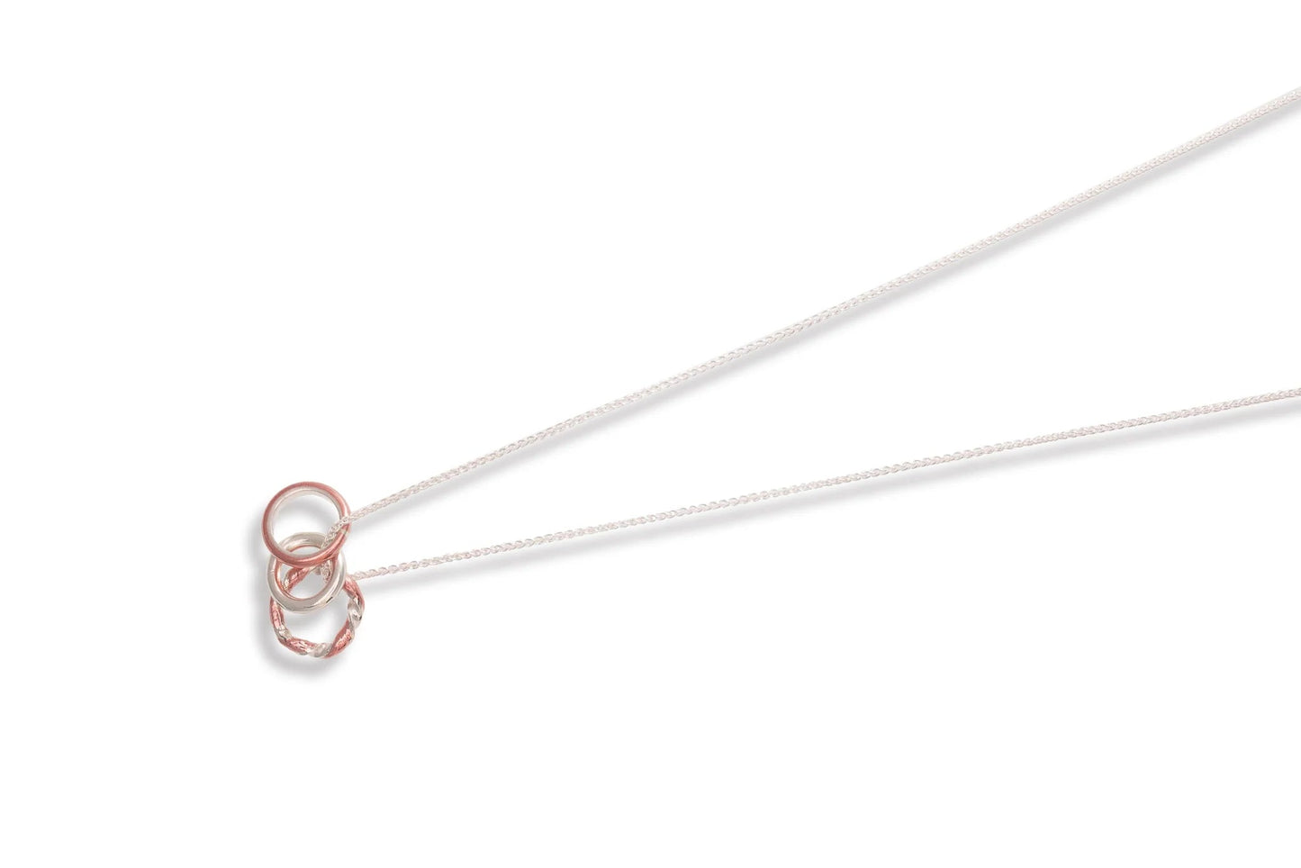 Claudine Moncion Stack14 necklace in sterling silver and copper on a white background. 