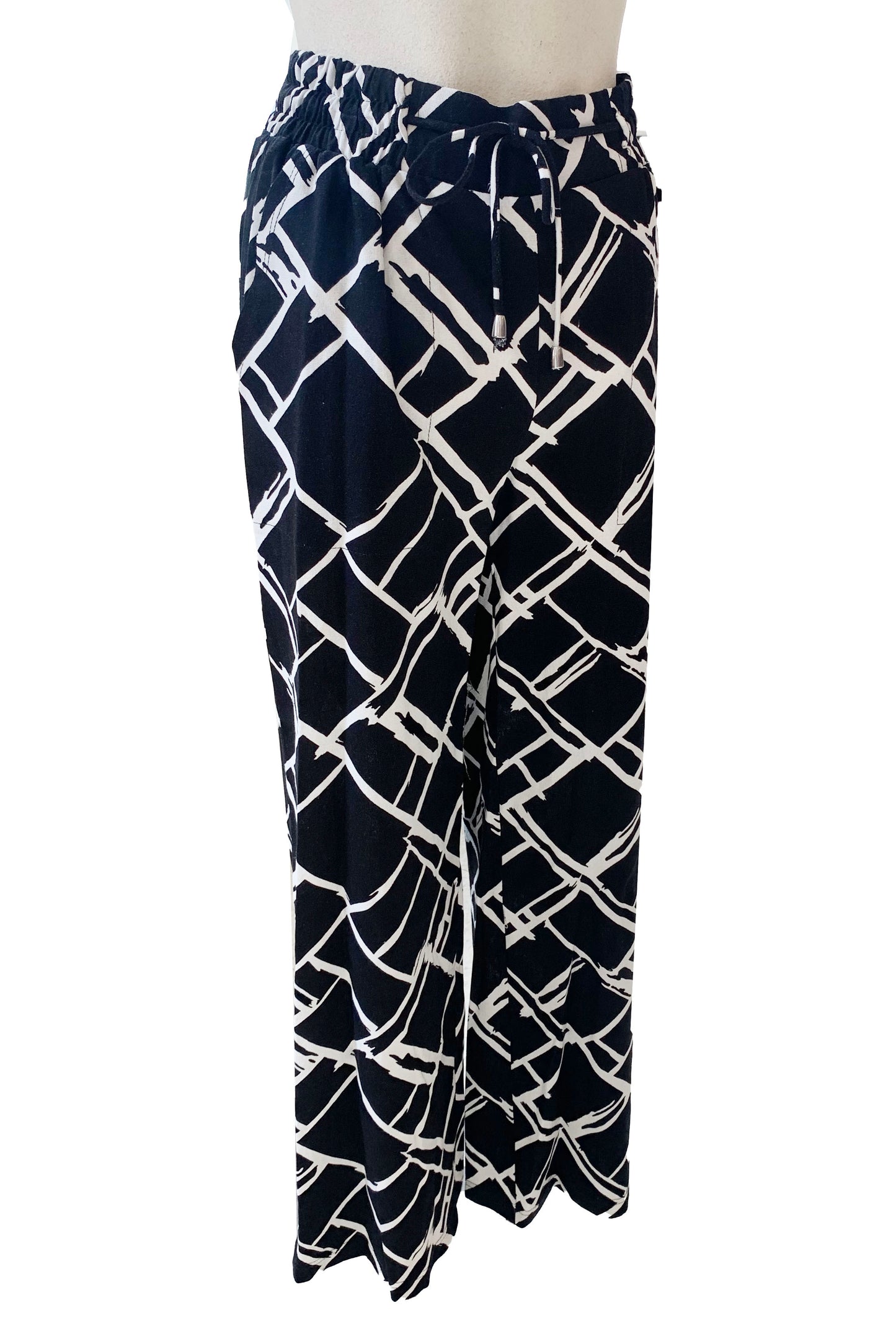 The Pure Essence Charmaine Pant in Black/White is show on a mannequin in front of a white background 