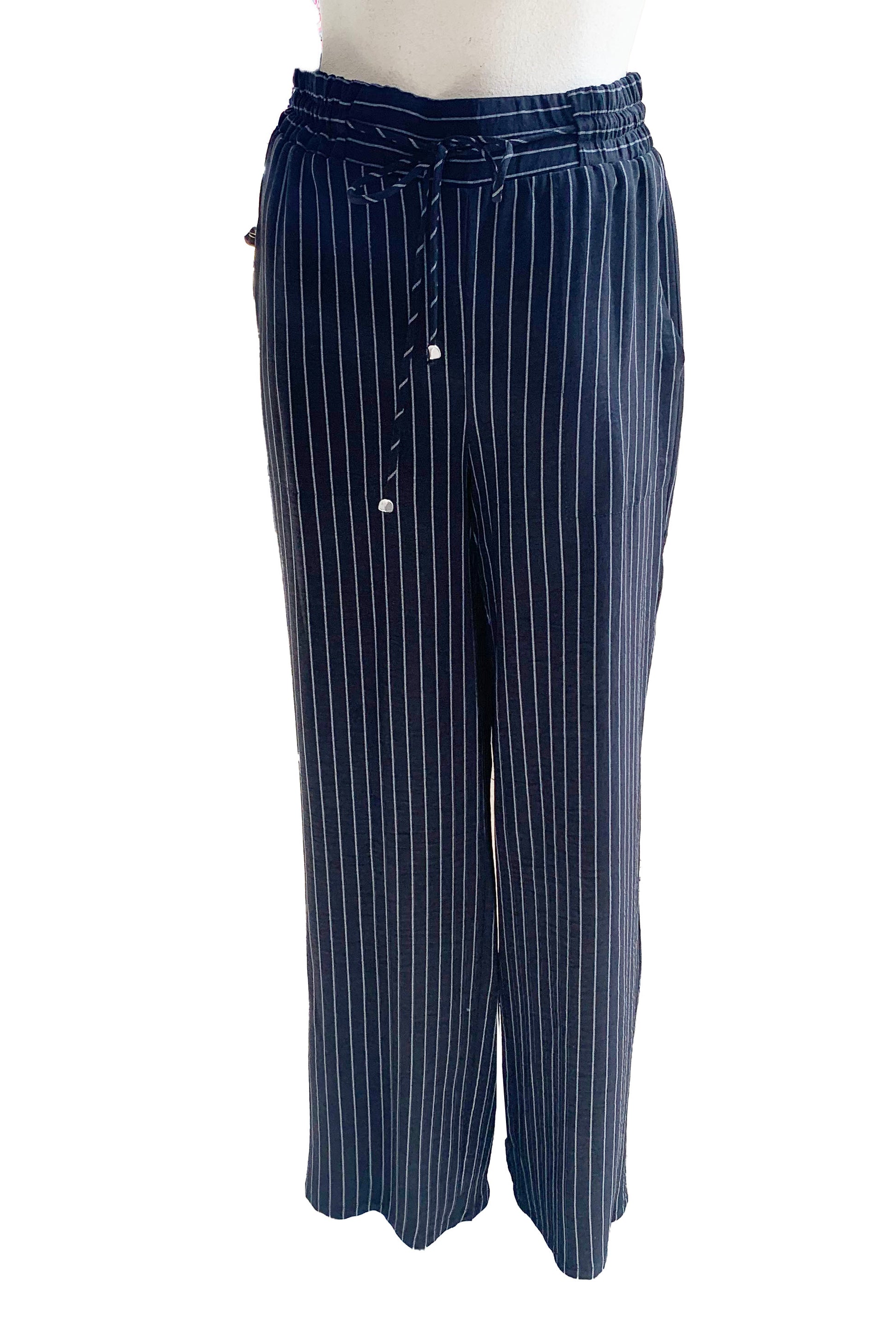 The Cheyenne Pants by Pure Essence in Black pinstripe are show on a mannequin in front of a white background 