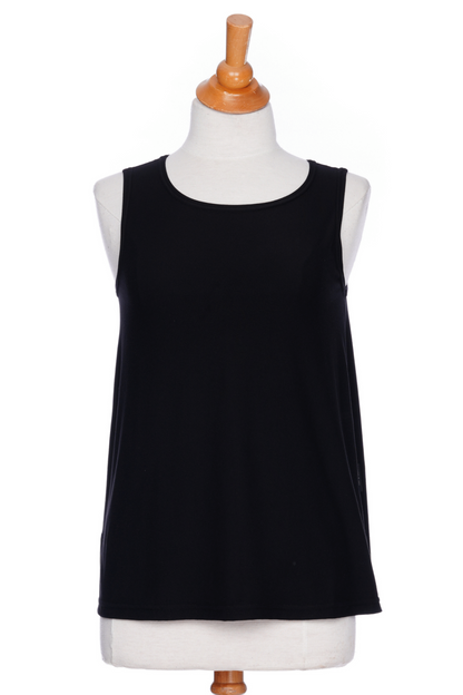 The Spritz Tank Top by Rien ne se Perd in Black, with wide straps and side slits, is shown on a mannequin in front of a white background 