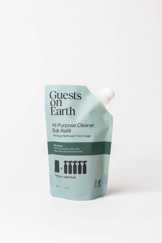 Guests on Earth All-Purpose Cleaner Bulk Refill pouch in a light blue-green color with dark green text and a white spout cap, photographed on a clean white background.