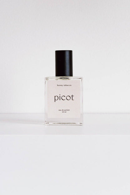 Picot Honey Tobacco eau de parfum bottle and on a white background