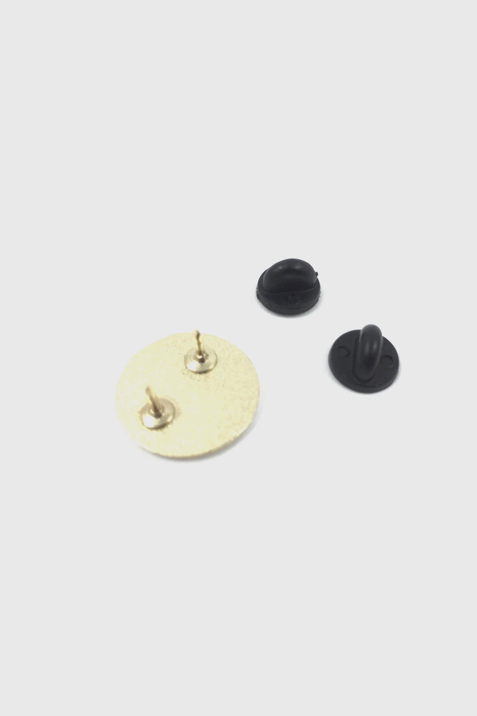 A back view of the Eyeball pin by Badaboöm Studio is shown against a white background.