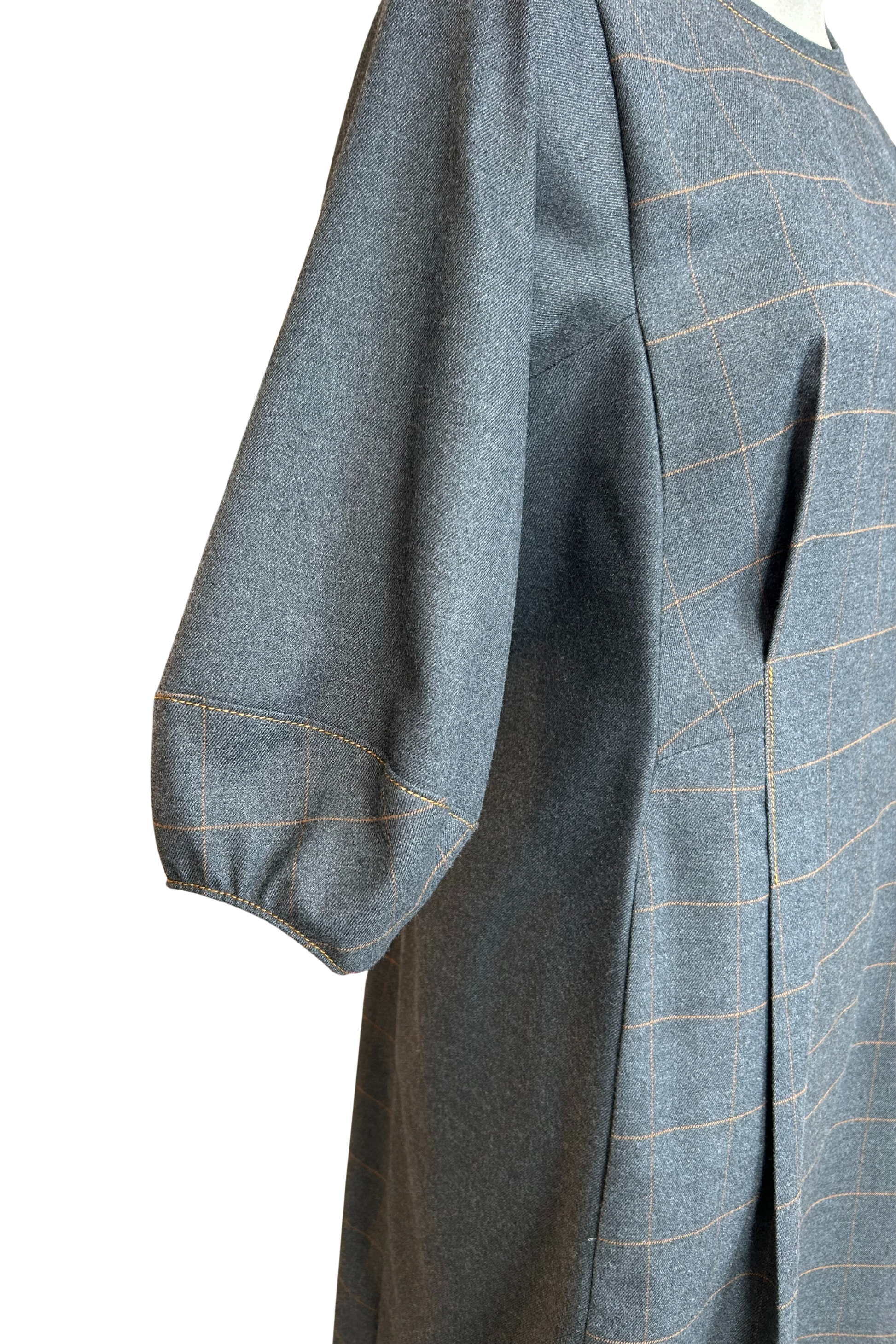 Close up of the structured cuff detail on the Hanna dress by Solomia in Grey.