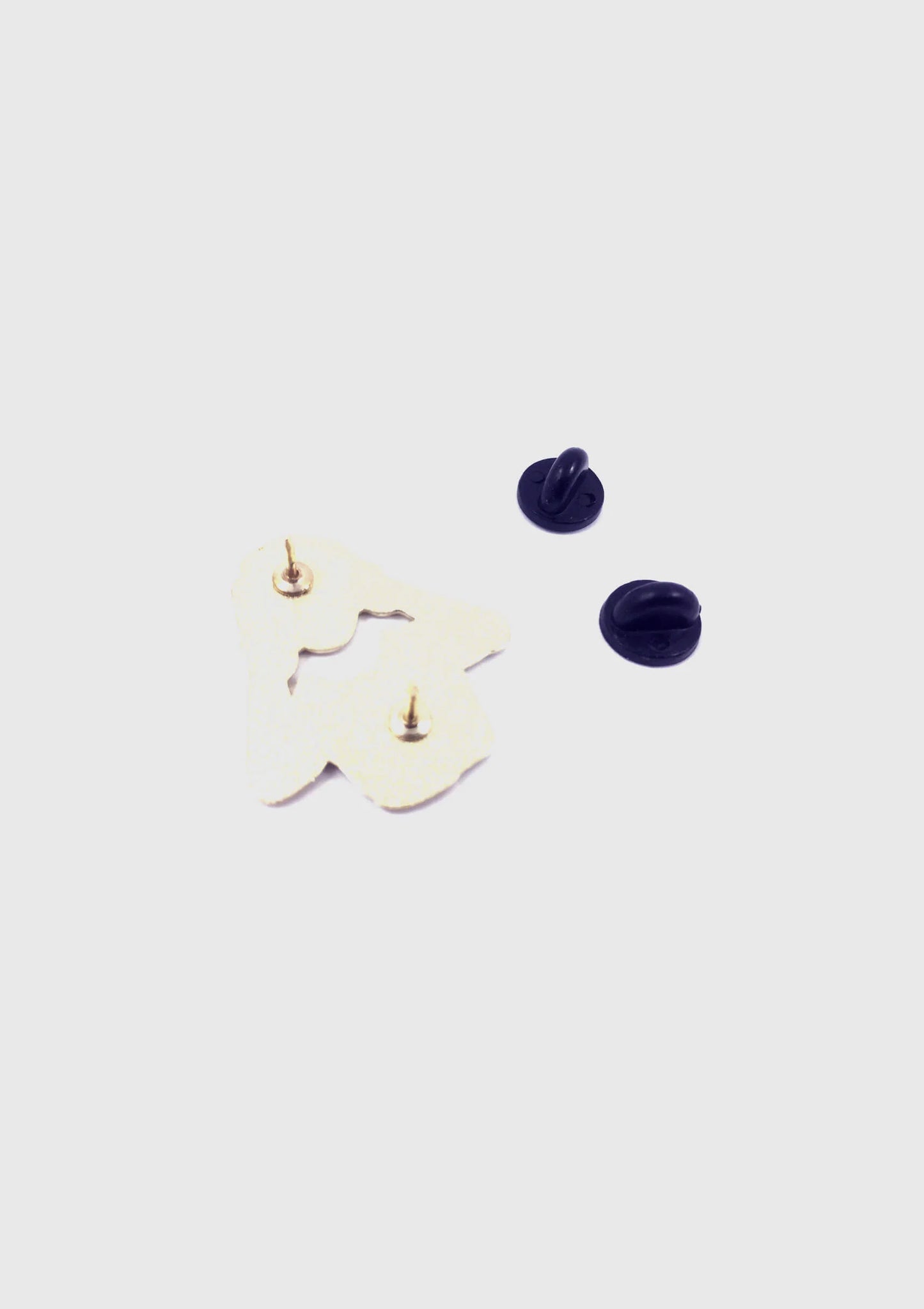 A back view of the Floating Head Pin by Badaboöm Studio is shown against a white background. 