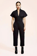 Herby Jumpsuit by Melow, Black, high collar, plunging neckline, fitted waist, short sleeves, 7/8 length legs, pockets, sizes XS to XXL, made in Montreal