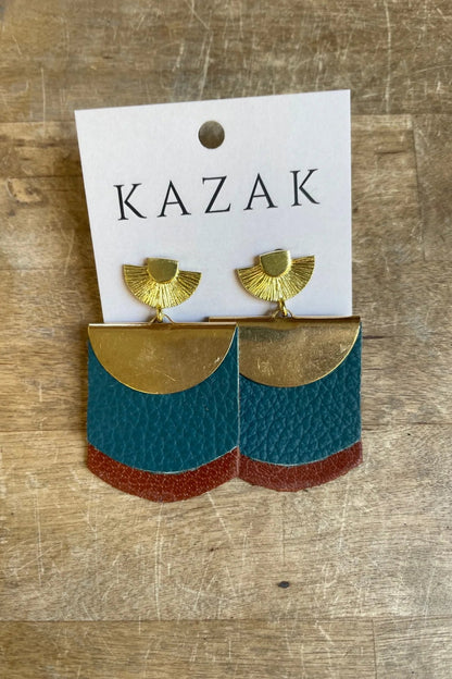 Bo Scaffa earrings in Teal/Caramel on a 'KAZAK' branded card on a wooden surface