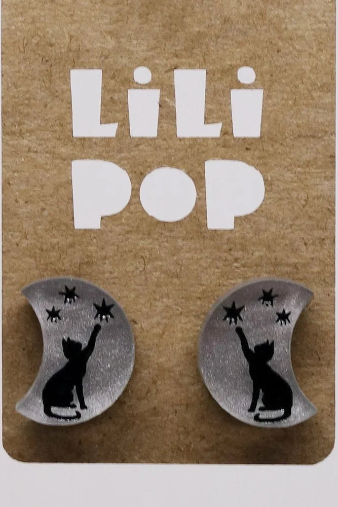 Moon shaped earrings with cat and star design on a Lili Pop branded card.