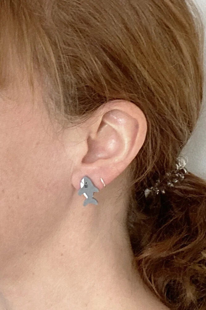 Person wearing Lilipop's shark shaped earring.
