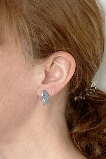 Person wearing Lilipop's shark shaped earring.