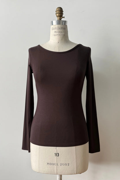 The Loretto Top by Kollontai in Chocolate, a slim fitting long sleeved top with a round neck, is shown on a mannequin against a white background. 