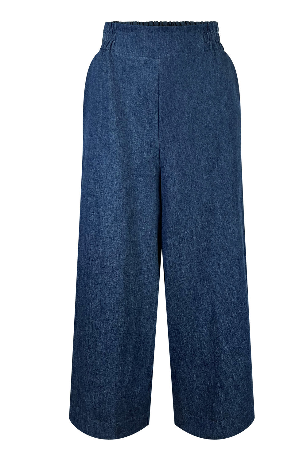 The Mateo Pants by Melow in Denim, ¾ wide leg pants with pull-on waistband that’s elasticized at the back, are shown against a white background. 