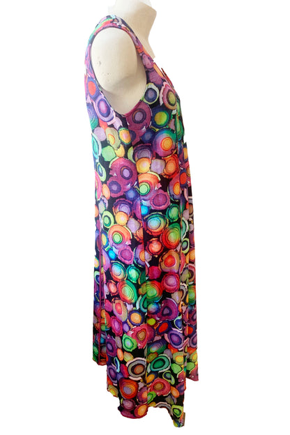 Side view of the Camryn Dress by Pure Essence, featuring a multicolour circles print, shown on a mannequin against a white background 