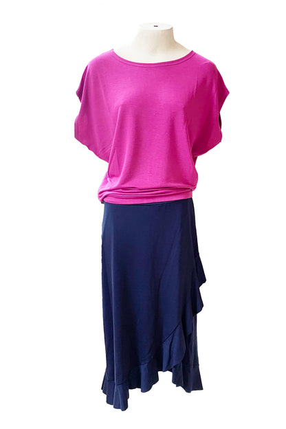 The Catrina Skirt by Pure Essence in Navy is shown with the Charles Top by Mandela in Magenta on a mannequin against a white background
