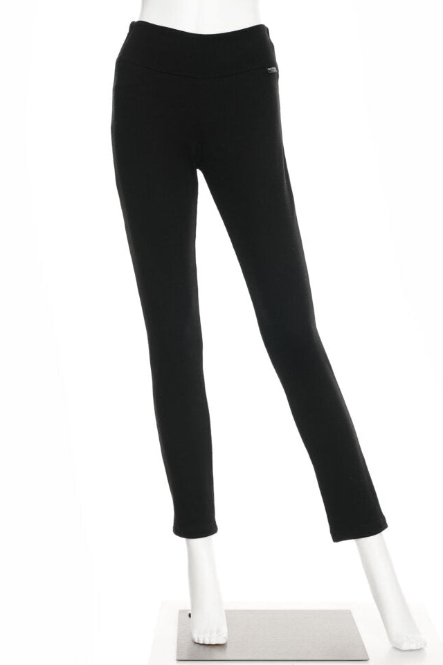 The Lichen Pant by Rien ne se Perd in Black, skinny leg pull-on pants in stretchy corduroy fabric, is shown on a mannequin in front of a white background. 