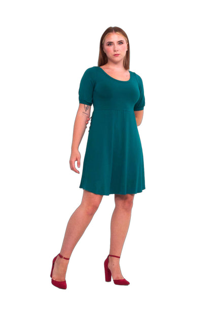 Petillante Dress by Slak, Turquoise, round neck, short slightly puffed sleeve with bands at the cuffs, fit and flare shape, circular skirt is shorter at the side seams, eco-fabric, bamboo, sizes XS to XXL, made in Montreal 