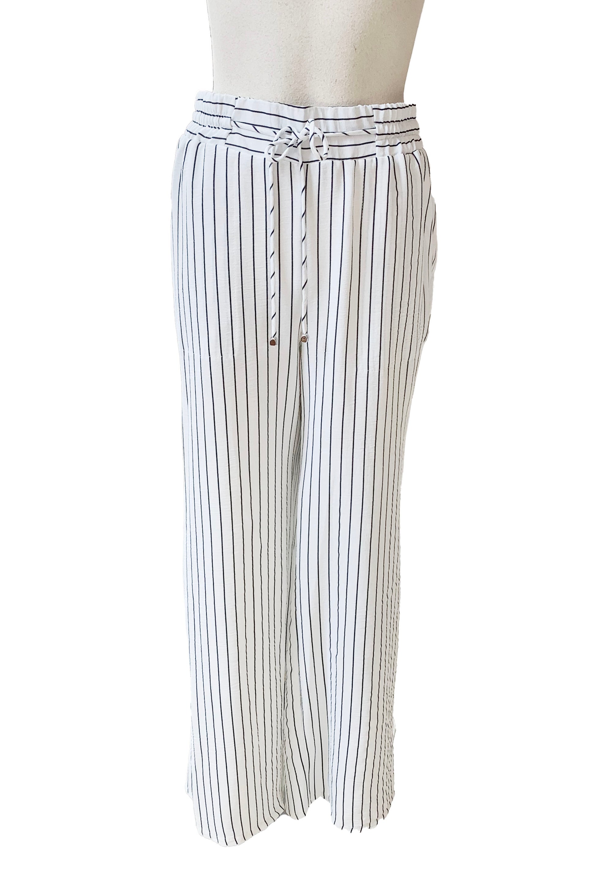 The Concordia Pant by Pure Essence in Ivory Pinstripe is shown on a mannequin in front of a white background