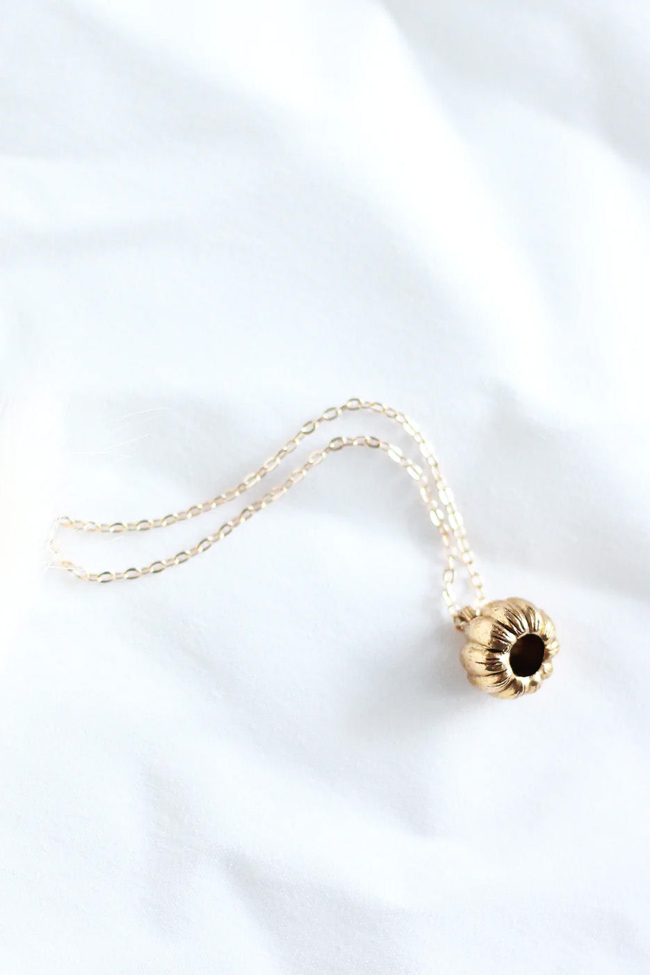 Pumpkin Necklace by Birch Jewellery, bottom view, Gold-plating, made in Ottawa