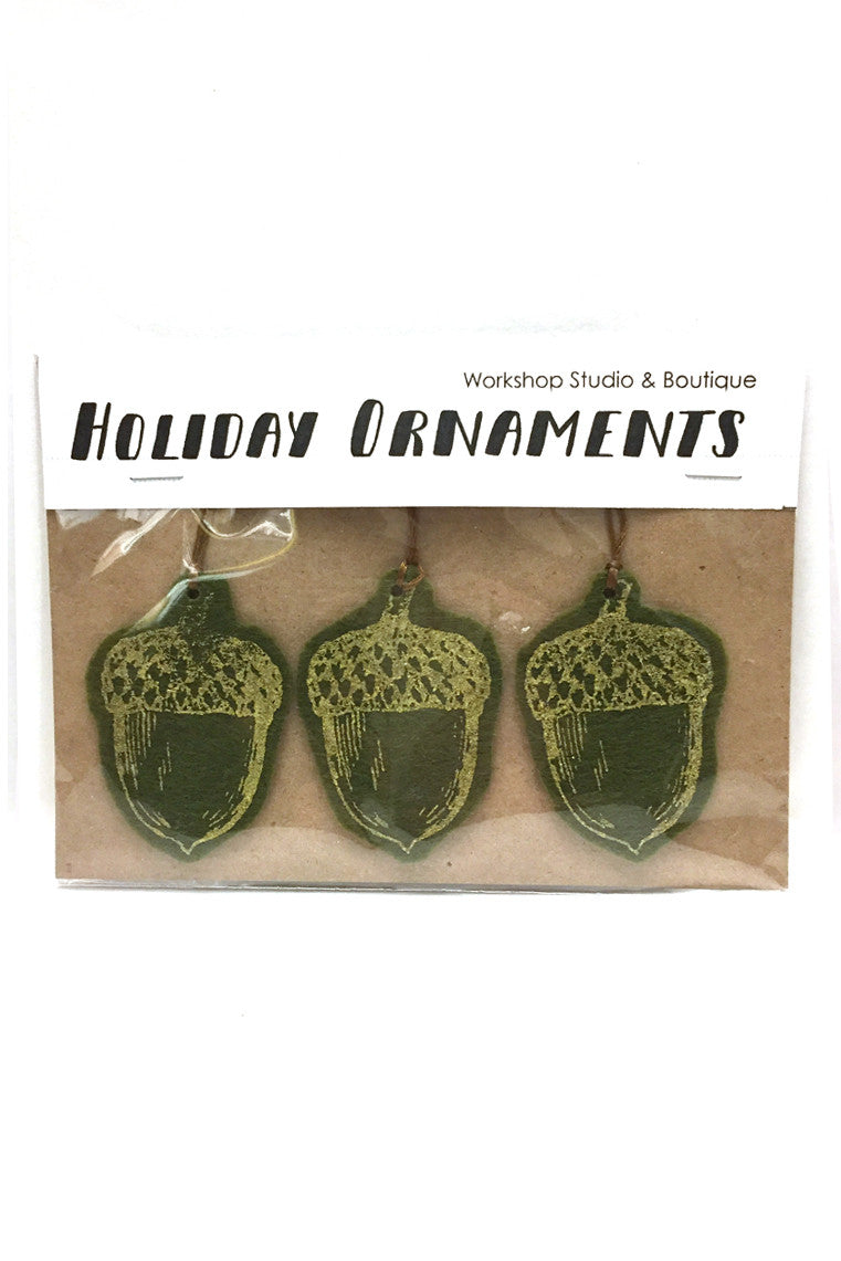 Workshop studio green and gold handprinted and cut acorn ornaments. Handmade in Ottawa