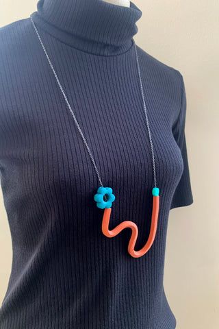 Terracotta Squiggle Necklace with Peacock Flower and transparent teal beads